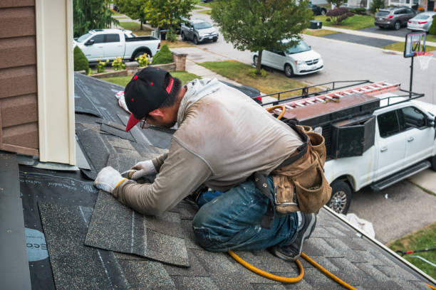Professional Roofing technician working in Holland, IA
